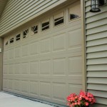 Raised steel panel garage door