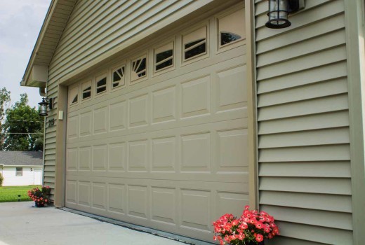 Raised steel panel garage door